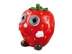 A red strawberry-shaped garden solar light with a smiling face, big eyes, and small brown feet.