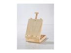 A wooden tabletop easel with an open storage box on a light wooden floor.