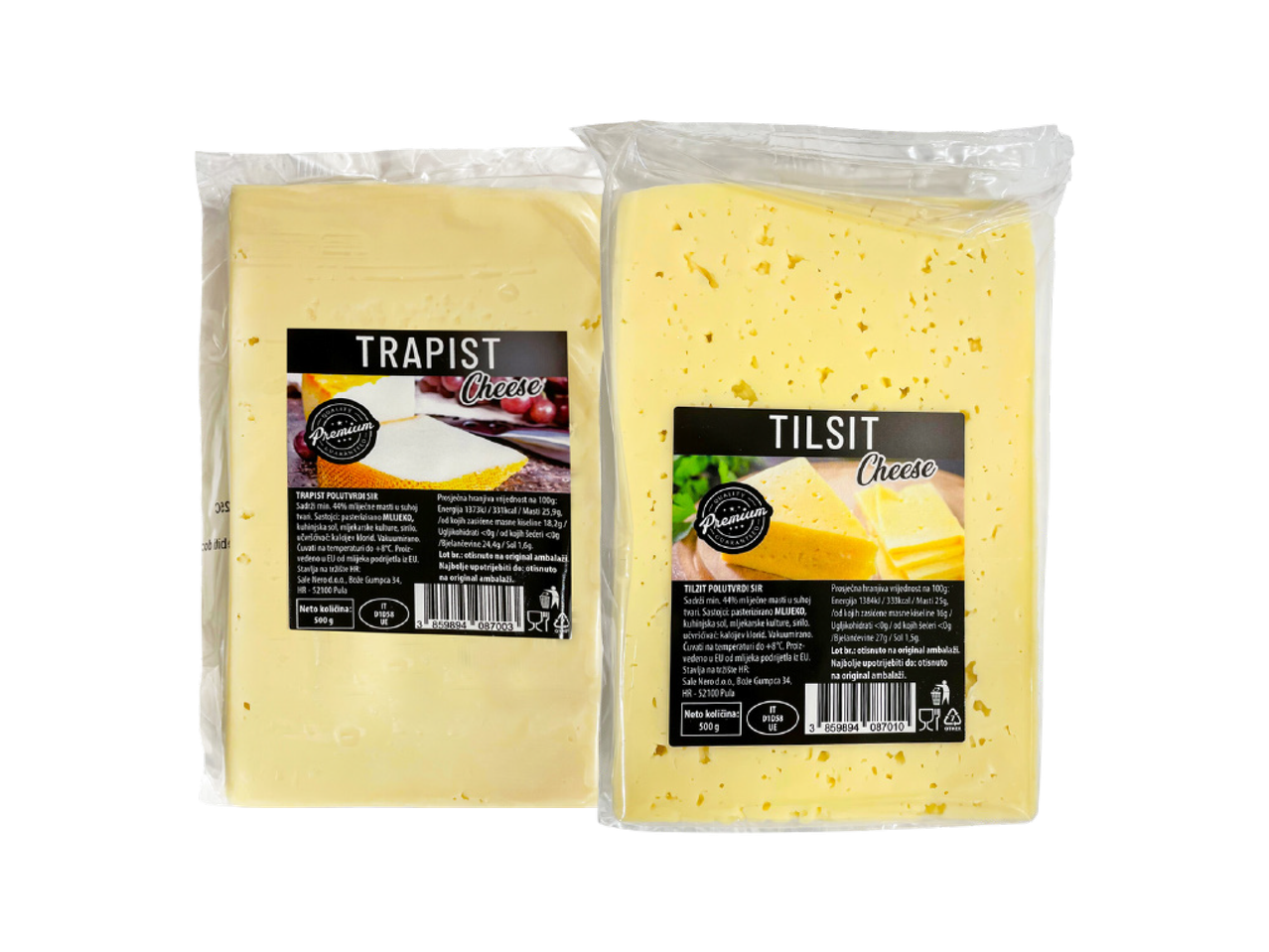 Dva pakiranja sira, Trappist i Tilsit, u prozirnoj foliji s etiketama.