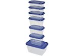 A stack of seven clear plastic food storage containers with blue lids.