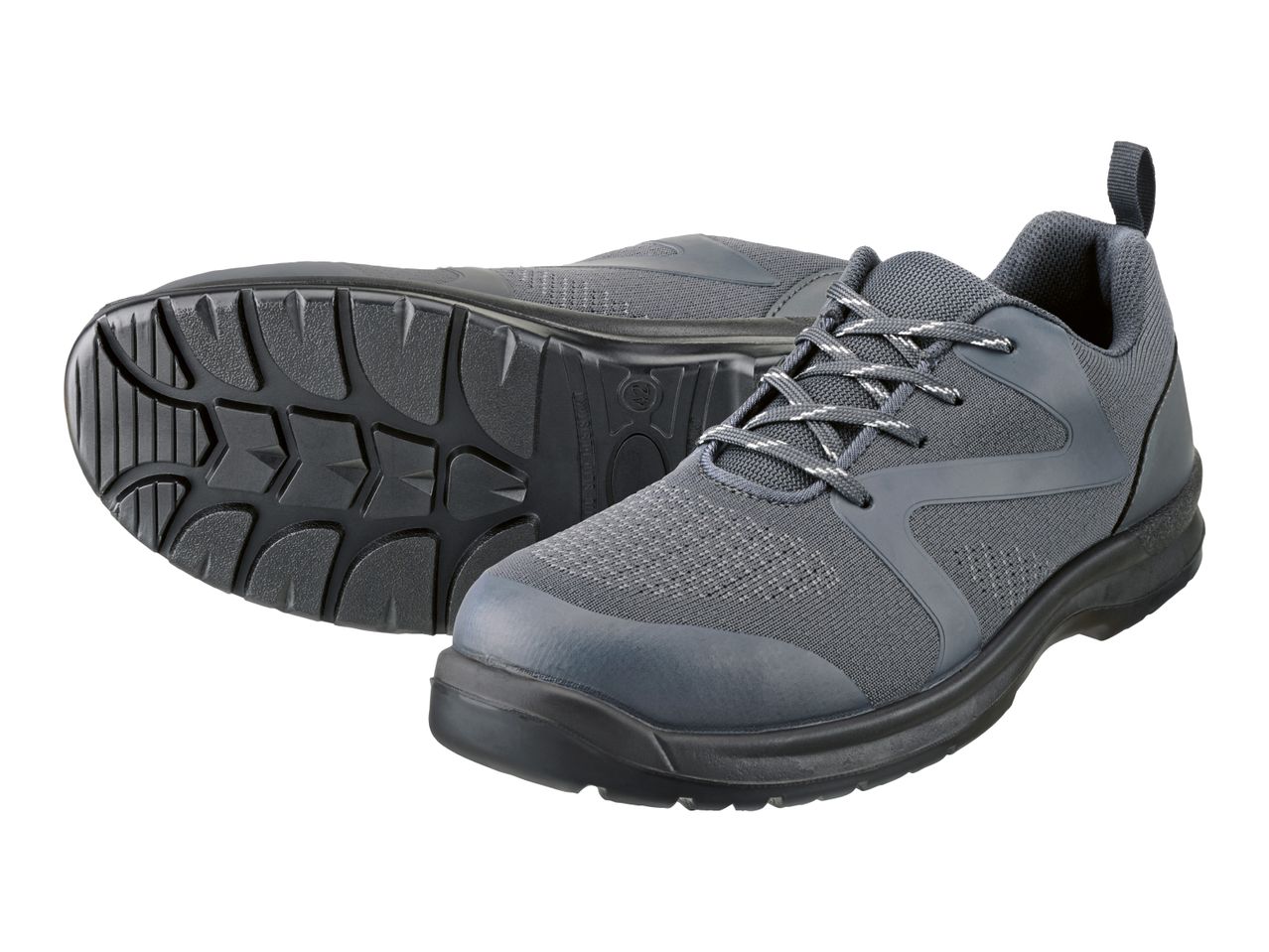 Pair of grey safety shoes with black soles, one showing the tread pattern.