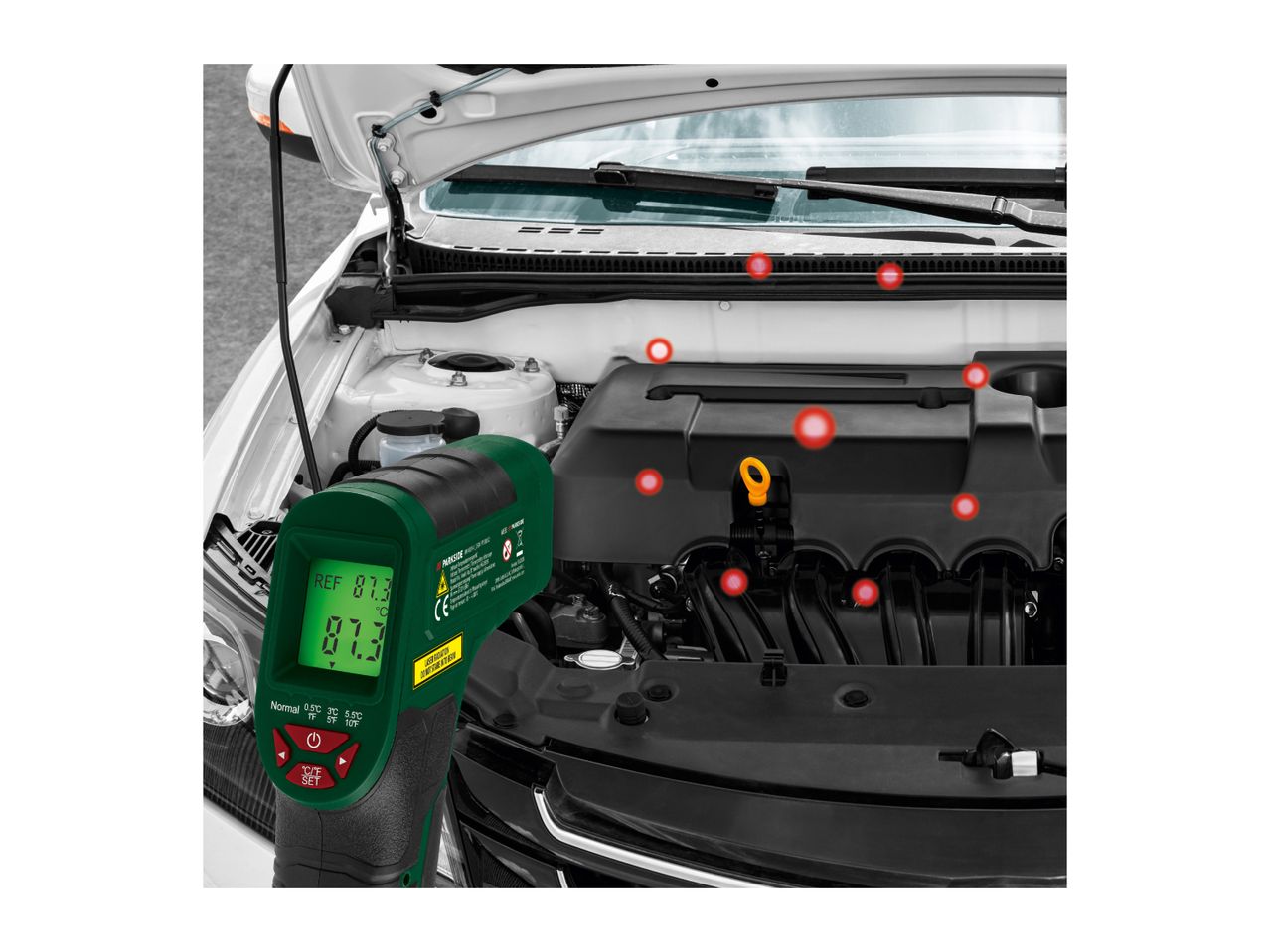 Parkside infrared thermometer measuring car engine temperature, showing 87.3°C.