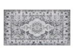Grey and white patterned rectangular rug with a vintage-style central medallion