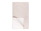 Beige patterned tablecloth with a folded corner revealing the underside.