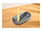 Spaghetti pasta portion measurer in grey, filled with uncooked spaghetti on a wooden surface.