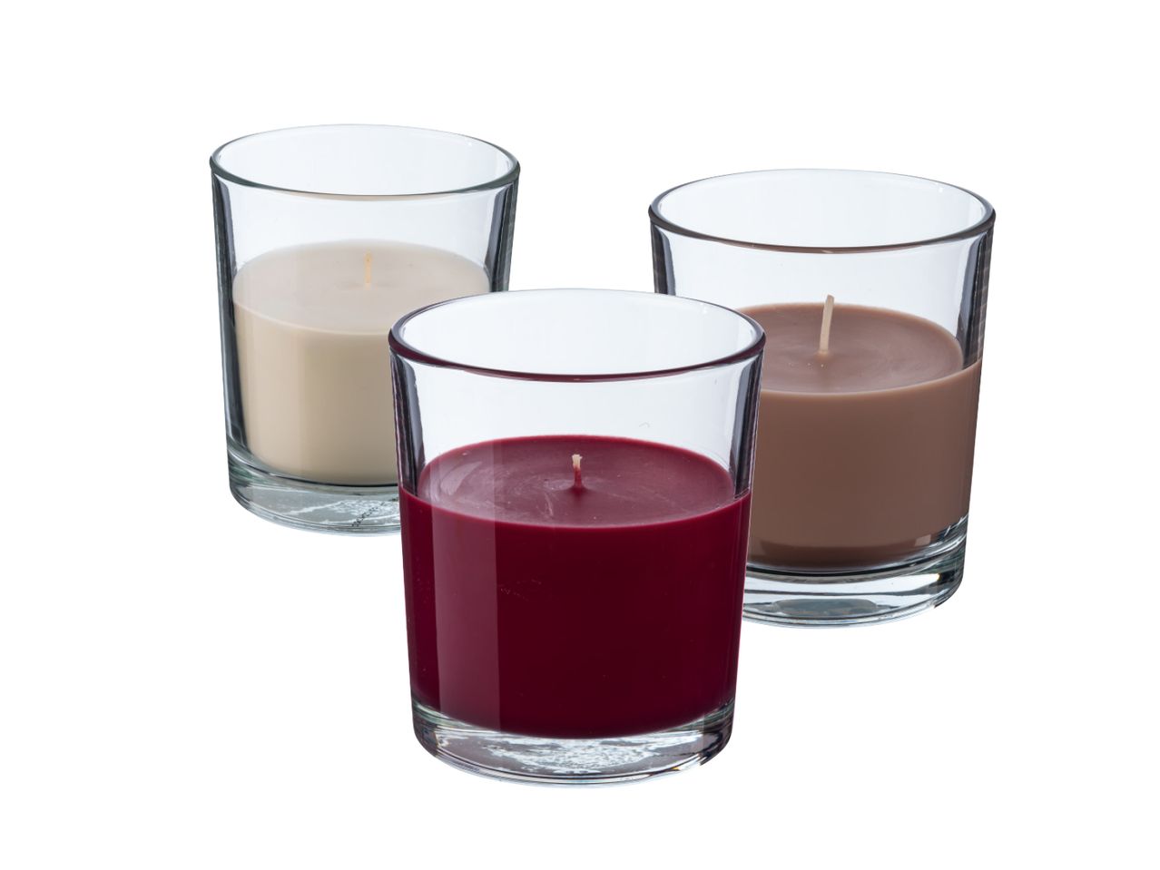 Tri mirisne svijeće u čašama: bež, smeđa i tamnocrvena.