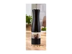 Black pepper mill filled with peppercorns on a wooden table