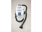 White and blue carpet cleaner with a hose and nozzle on a light-colored carpet.