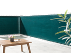 Livarno Balcony/Fence Privacy Screen in dark green, with a wooden table and plant on a patio.