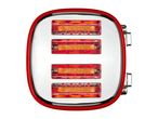 Top view of a red four-slice toaster with glowing heating elements and toast inside