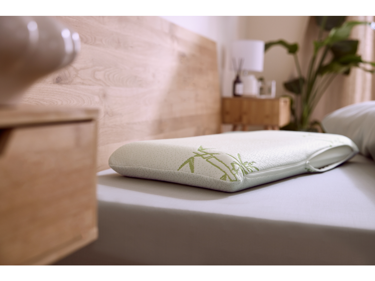 Livarno Premium Ergonomic Neck Support Pillow with bamboo design on a bed