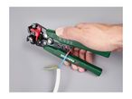 Hand holding automatic wire strippers, stripping a blue wire from a white cable.