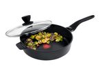 Deep frying pan with glass lid containing cooked brussels sprouts and red onions