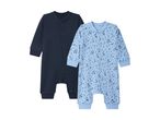 Two baby sleepsuits, one dark blue and one light blue with black star patterns.