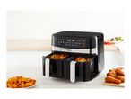 Tower air fryer with fries and chicken, alongside a plate of potato wedges.