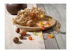 Autumnal string lights with pumpkins and leaves, dried flowers, and nuts on a wooden tray.