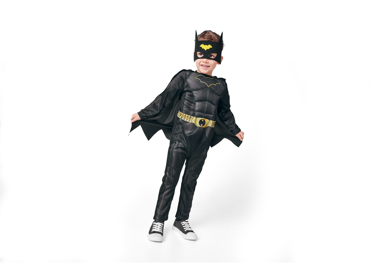 A young boy in a Batman costume with a mask and cape.