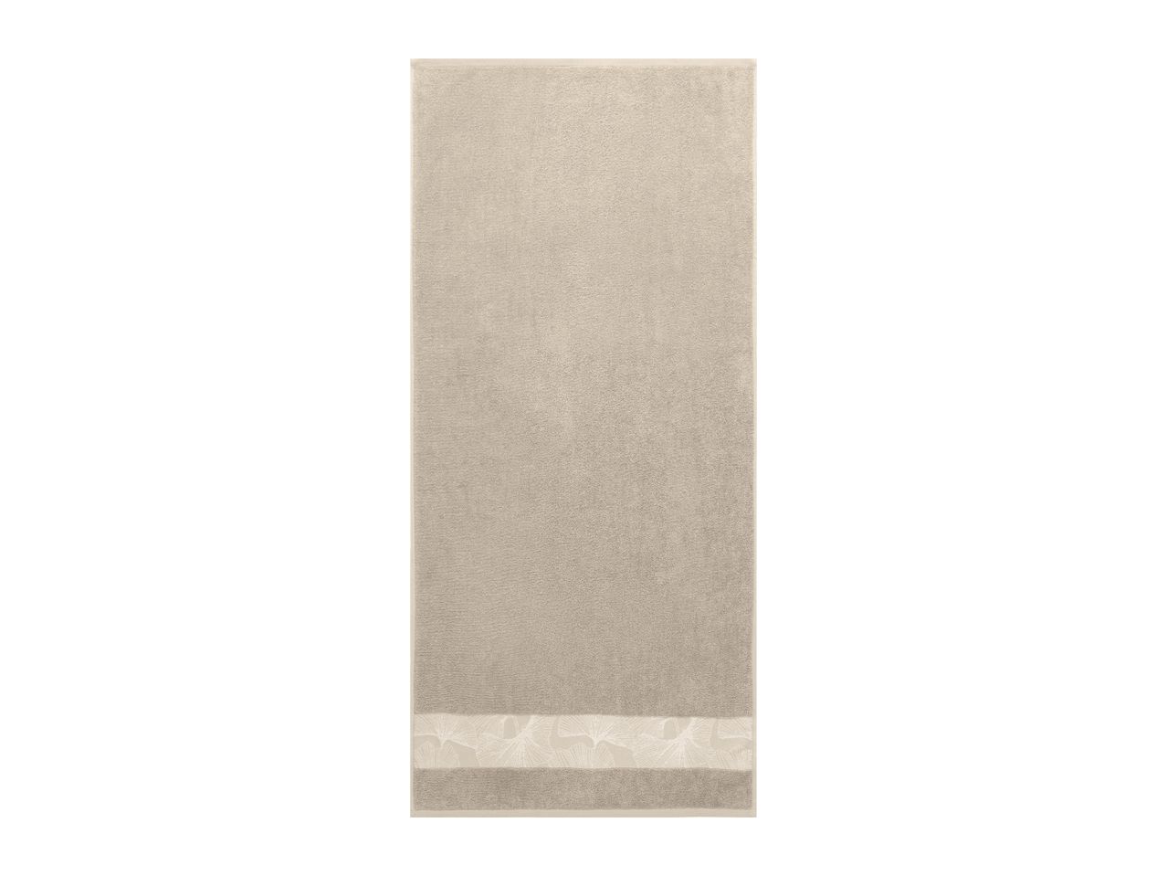 Beige towel with a decorative floral border.