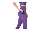 Woman in purple sports bra and leggings with a phone in the side pocket.