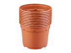 Stack of brown plastic plant pots, ready for gardening or seedlings.