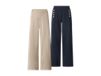 Dvoje ženskih hlača širokih nogavica: jedne bež s gumbima na pojasu i jedne tamnoplave s ukrasnim gumbima.