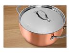Copper-colored pot with a stainless steel lid on a wooden surface.