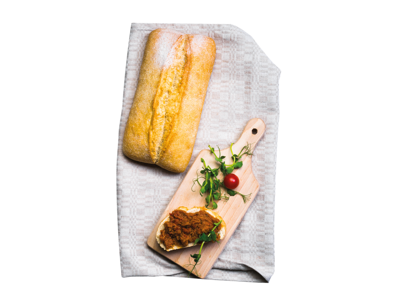Ciabatta leib ja maitsva määdega kaetud viil, kaunistatud hernesvõrsete ja kirsi tomatitega.