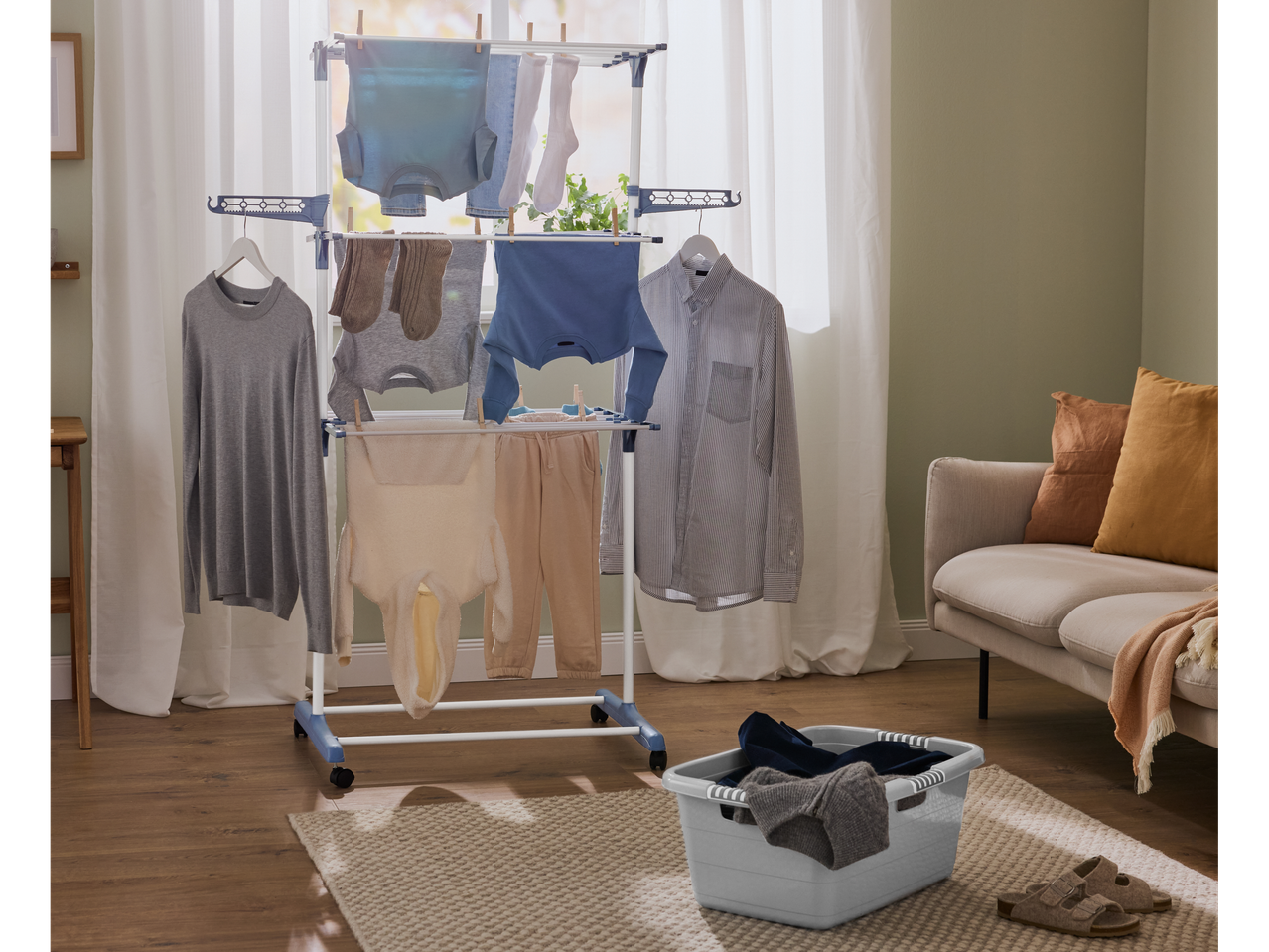 W5® laundry basket and clothes drying rack in a living room.