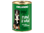 Pâtée pour chien Orlando au bœuf et gibier dans une boîte verte, avec un Bouvier Bernois.