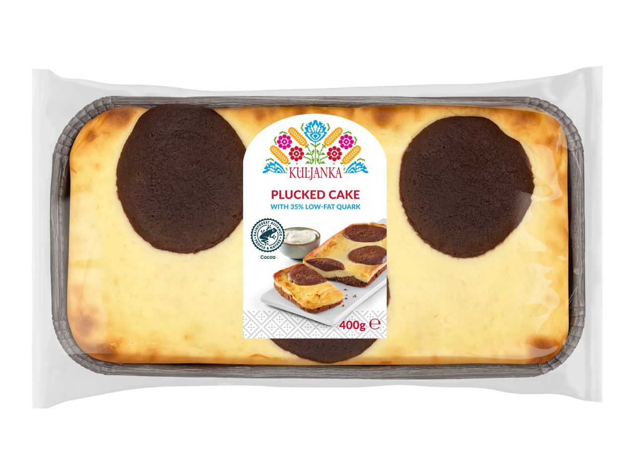 A package of Kārums Plum Cake, featuring a rectangular cake with chocolate swirls.