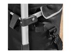 Close-up of a black shopping trolley bag with a silver frame and plastic connectors.