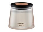 Deluxe Orange Groves scented candle in a glass jar.