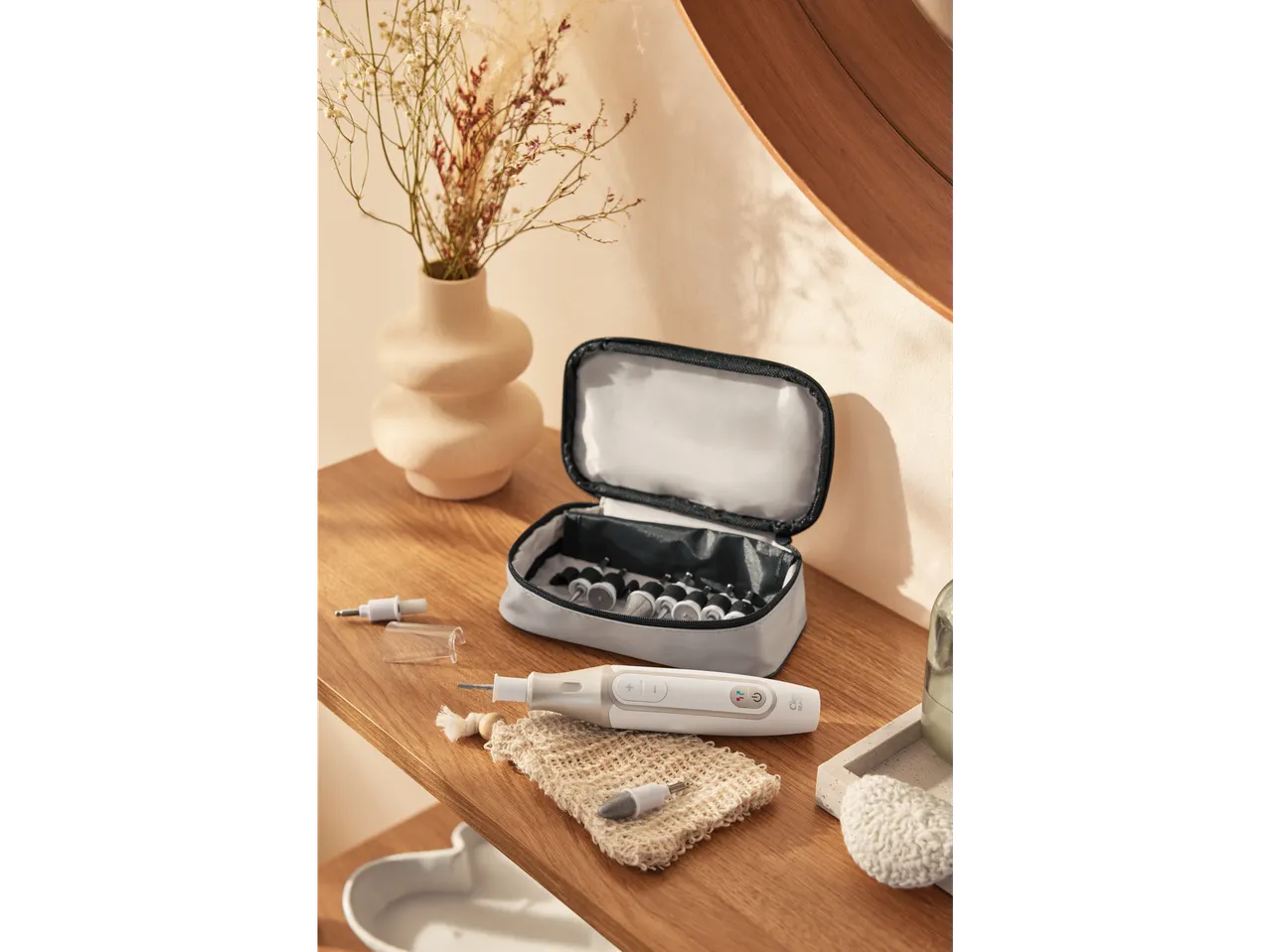 Cien BEAUTY Cordless Manicure/Pedicure Set with various attachments, case, and accessories on a wooden surface.