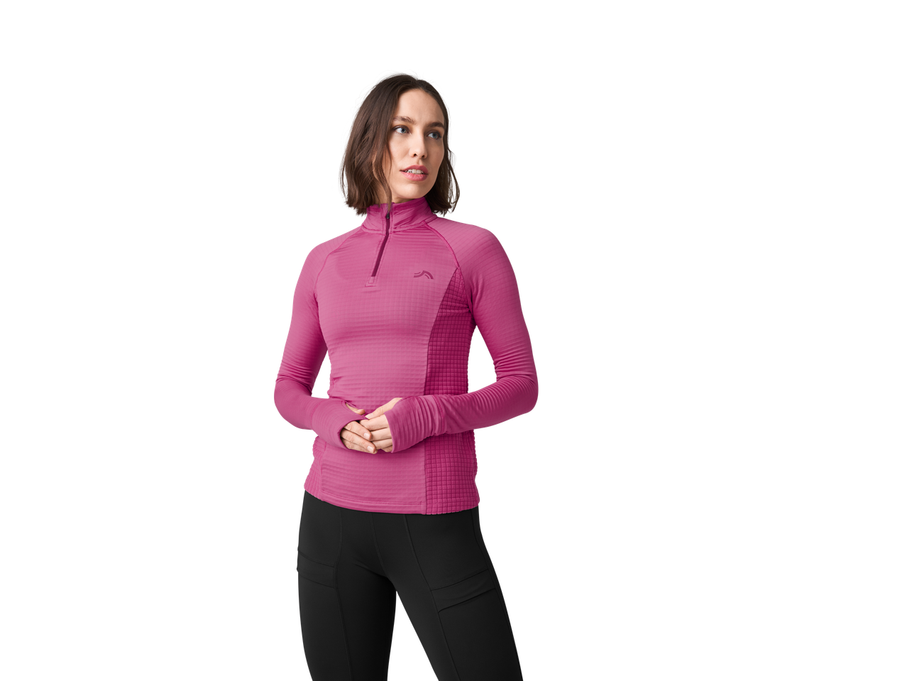 A woman wearing a pink Crivit Ladies' Long Sleeve Sports Top and black leggings.