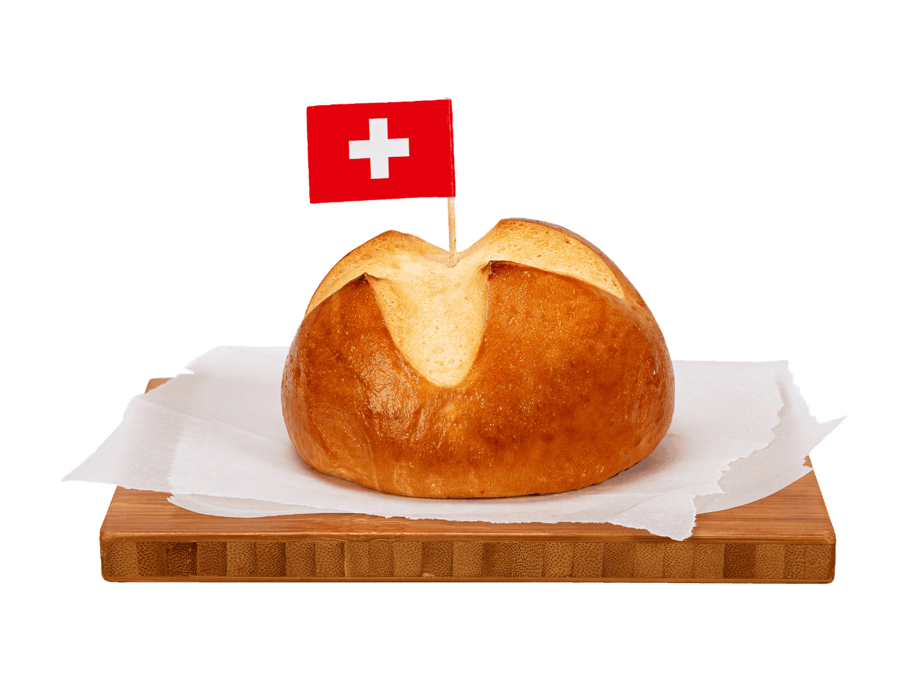 Petit pain suisse sur une planche en bois avec du papier sulfurisé.