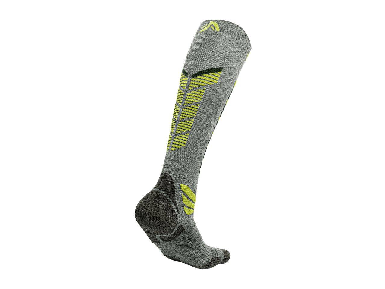 A single grey and neon yellow athletic sock with a patterned design