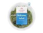 Chilled Japanese style wakame salad with sesame in a clear plastic container, 100g.