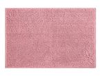 Close-up of a pink bath mat with a textured, looped pile.