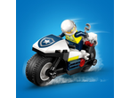 Toy police motorcycle with a police minifigure on a blue background.