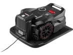 Robotic lawnmower on a charging station, featuring a control panel, large wheels, and a red emergency stop button.