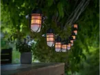 Outdoor string lights with vintage-style lanterns.
