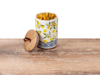 Pasta in a lemon-patterned ceramic jar.
