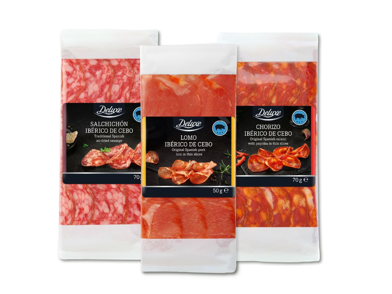Kolm pakki Deluxe Ibérico de Cebo tooteid: salchichón, lomo ja chorizo.