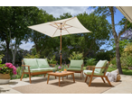 Livarno Crank & Tilt Parasol shading a patio with wooden outdoor furniture and green cushions.