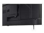 Rear view of a black television showing various input ports and a stand.