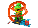 Hot Wheels rinkinys su žaliu dinozauru ir oranžine lenktynių trasa.
