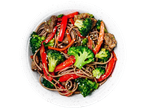 Irish Beef Stir Fry with noodles, broccoli, red peppers, and sesame seeds in a white bowl.