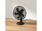 Black table fan with metal mesh guard.