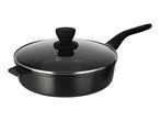 Black frying pan with a glass lid and a long handle, viewed from an angle.