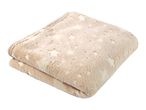 A folded beige blanket with a star pattern.